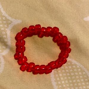 Red bracelet.